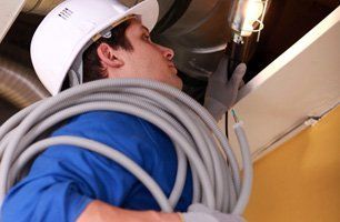 B & B Electric crew installing conduit